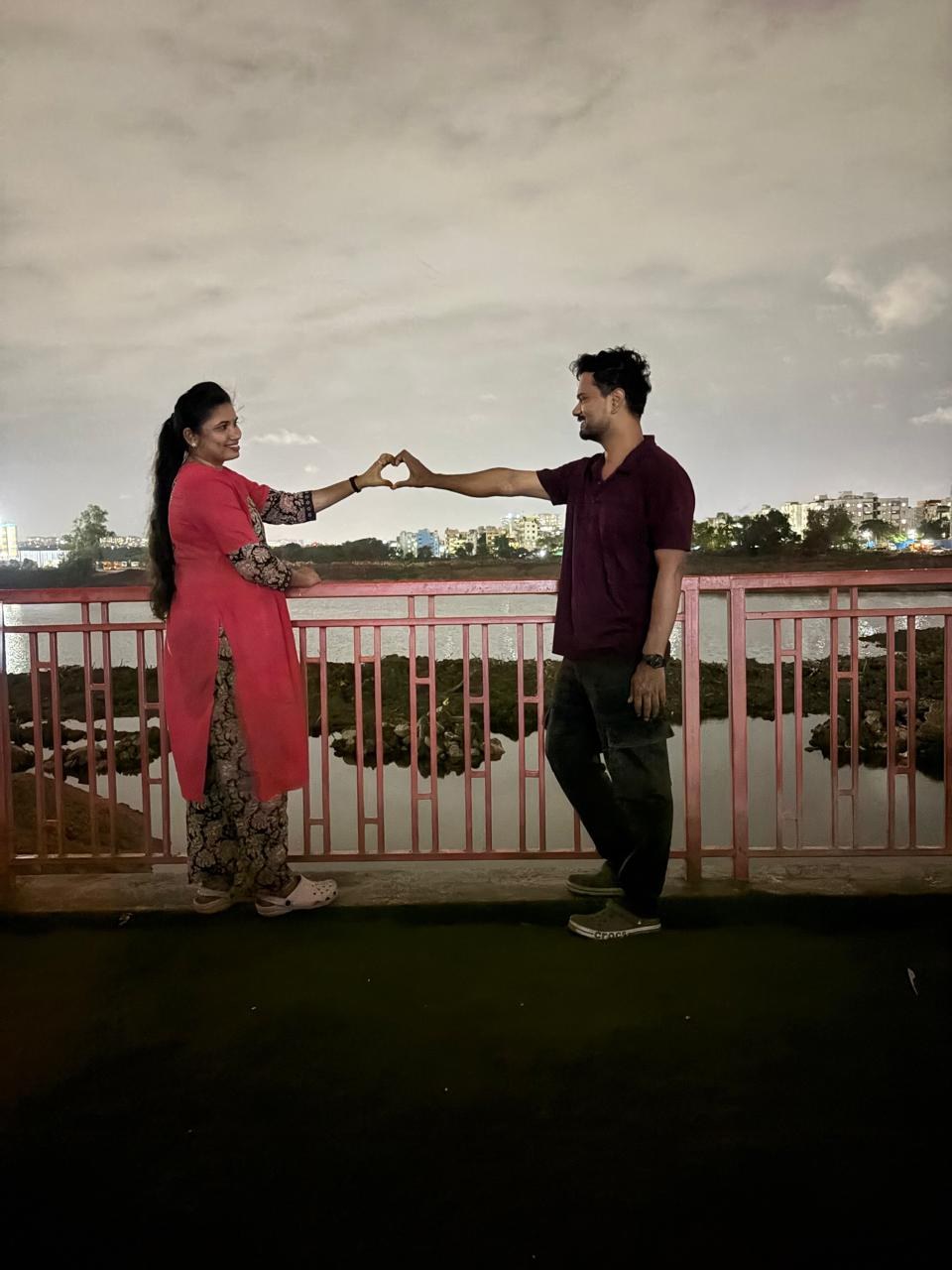 Lakshmi and Srinivas together by the lake